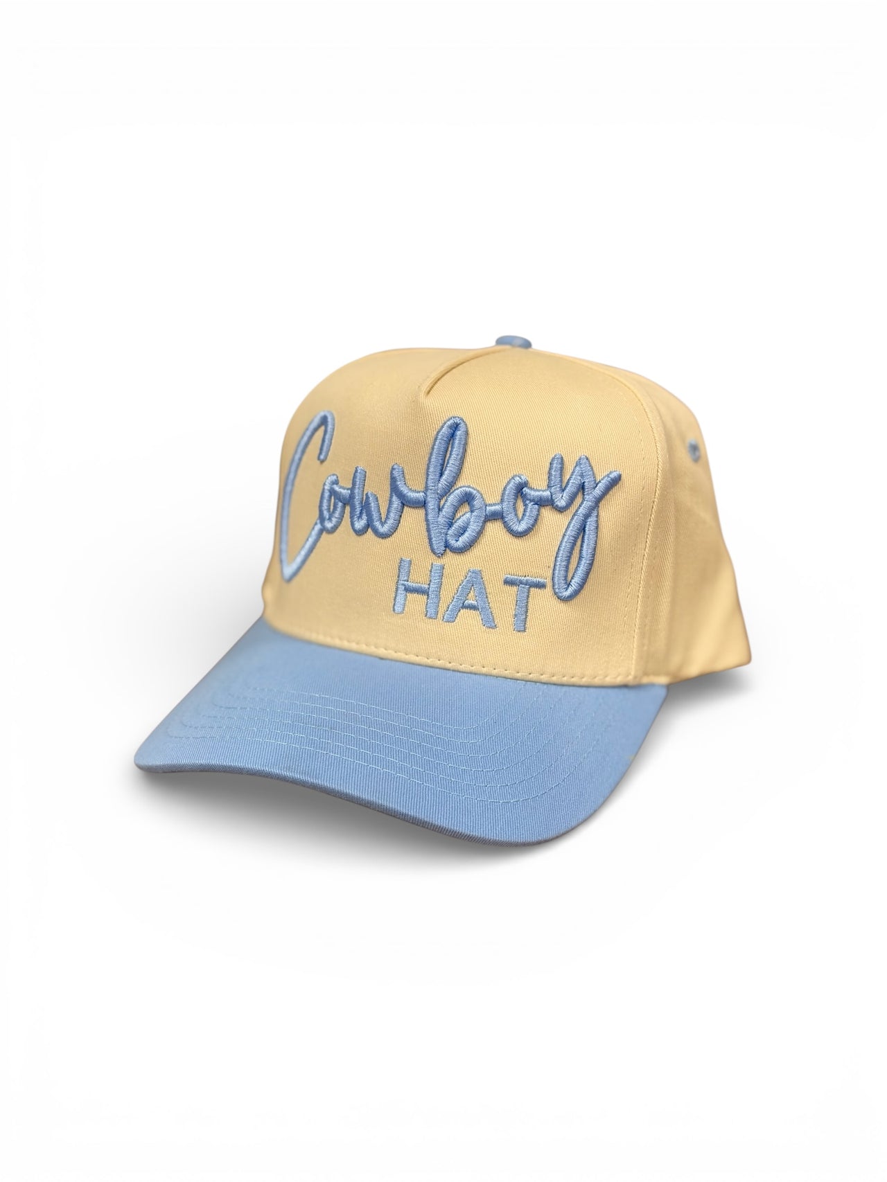 Beige and blue cap with 'Cowboy Hat' text on a white background